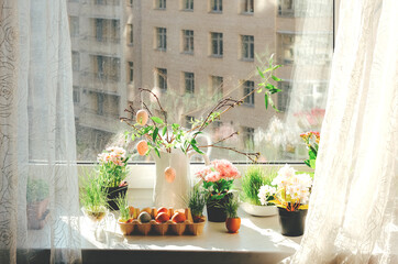 Easter decor. Windowsill with pink Easter eggs.
