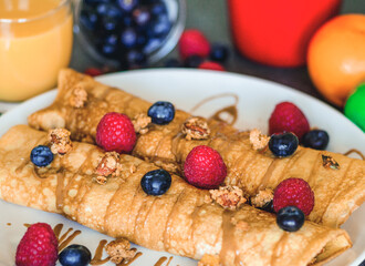 Some delicious strawberry, rasberry and blueberry crepes for the breakfast