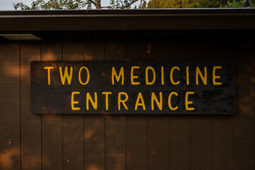 Two Medicine Entrance Sign On Side of Building
