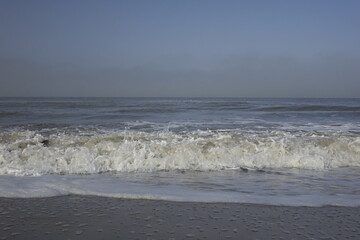 Rolling waves at the Dutch North Sea coast, concept: freshness, holiday, serenity (horizontal), Noordwijk, South Holland, Netherlands