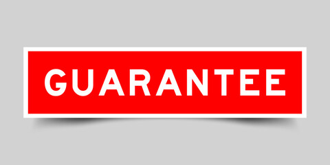Sticker label with word guarantee in red color on gray background