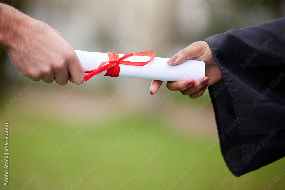 Sticker Unlock your potential even further with this token. Closeup shot of an unrecognisable graduate receiving their certificate on graduation day.