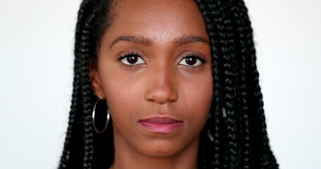 Portrait black African teen girl looking at camera, close-up face