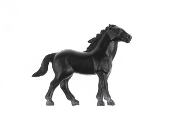 toy black horse isolated on white background