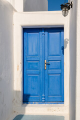 Blue Greek door. Pyrgos village on Santorini island, Greece