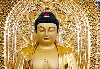 Close up of a golden Buddha statue