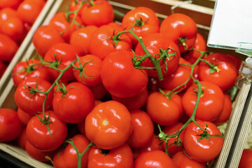 Showcase with red tomatoes. Vegetables at supermarket. concept of healthy and organic food consumption
