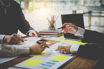 Business financial, accountant discussing with partner are meeting to audit finance planning sales to meet targets set in next year. stock market concept.