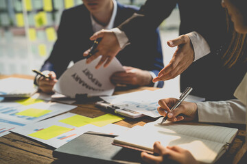 Business people discussing on performance revenue in meeting. businessman working with co-worker team. financial adviser analyzing data with investor.