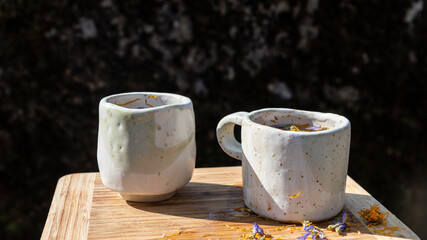 Two Handmade Ceramic Mugs outdoors
