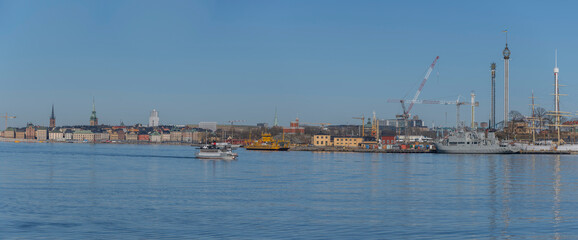Fototapeta na wymiar Panorama view with passenger commuting boat, old ferry, a sunny spring day in Stockholm 