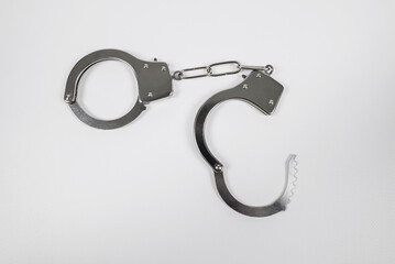 metal handcuffs on white