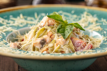 Italian alfredo pasta on the wooden background