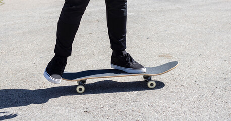 Close-up of a legs on a skateboard 