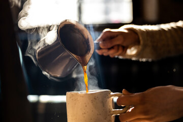 Fototapeta na wymiar Serving Coffee in Handmade Ceramic cup