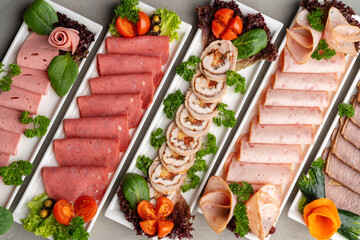 Platter of fresh meat cold cuts on table