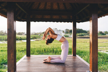 Flexible ?aucasian girl in activewear enjoying yoga training relaxing and feeling body vitality,...