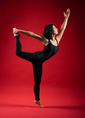 Fototapeta premium old attractive woman practicing yoga doing pilates. poses with namaste, workout, wear sportswear, pants and top, indoors full length, yoga studio
