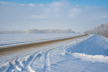 Fototapeta na wymiar Winter snow landscape. Road in winter