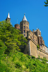 Fototapeta na wymiar Hohenzollern Castle on mountain top, Germany. This castle is famous landmark in Stuttgart vicinity.