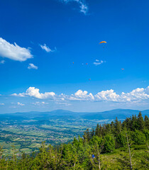 Flying hang gliders above Skrzyczne peak in Poland