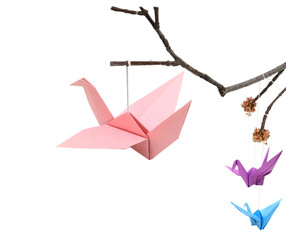 Origami birds on branch