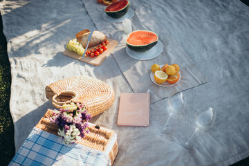picnic served in nature with vegetables, cheese and fresh bread