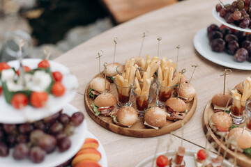 buffet, catering, various canapes and salads in a glass