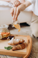 breakfast served with fresh croissants, tea and fruit
