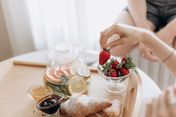breakfast served with fresh croissants, tea and fruit