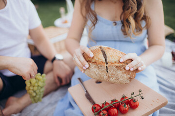 picnic served in nature with vegetables, cheese and fresh bread