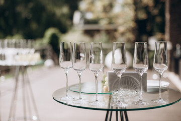 many empty clean glasses for champagne or white wine