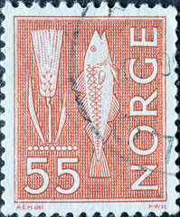 Norway - circa 1963: a postage stamp from Norway, showing a fish and an ear of grain