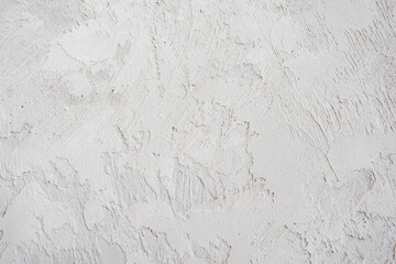 artistic plaster on a gray and white wall. Repairs. elements of wall decor. copy space. texture. background.