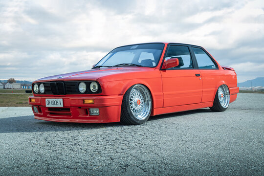 SABADELL, SPAIN-OCTOBER 9, 2021: BMW 3 Series (E30) two-door sedan (second generation of BMW 3 Series), red colored