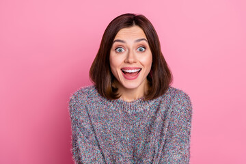 Portrait of attractive cheerful amazed funky girl sudden news gift reaction isolated over pink pastel color background