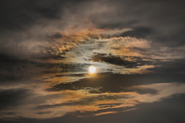 Sun in the clouds and close up