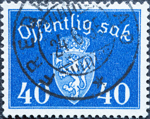Norway - circa 1946: a postage stamp from Norway , showing the coat of arms of Norway with a crown....