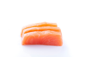 three pieces of raw salmon sashimi sushi japanese food in side closeup sliced ​​isolated on white background