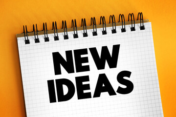 New Ideas text on notepad, concept background