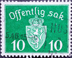 Norway - circa 1941: a postage stamp from Norway , showing the coat of arms of Norway with a crown....
