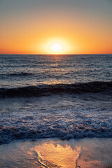 Naklejka premium The sea wave. Sunset in the sea. The power of the elements.