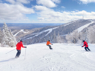 Mont Tremblant in winter with skiers on the foreground, Quebec, Canada