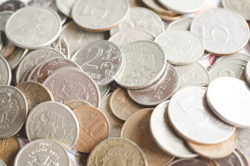 Russian rubles coins pile up on an investor's desk