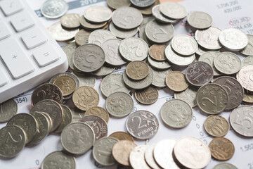 Russian rubles coins pile up on an investor's desk