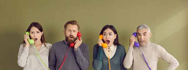 Portrait of group of people talking on landlines and having shocked and frightened face. Men and...