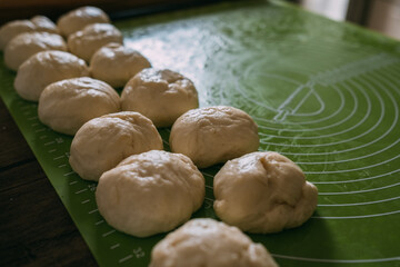 Pie dough balls on a rolling mat. High quality photo