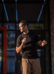 handsome man with short bristles in a black T-shirt