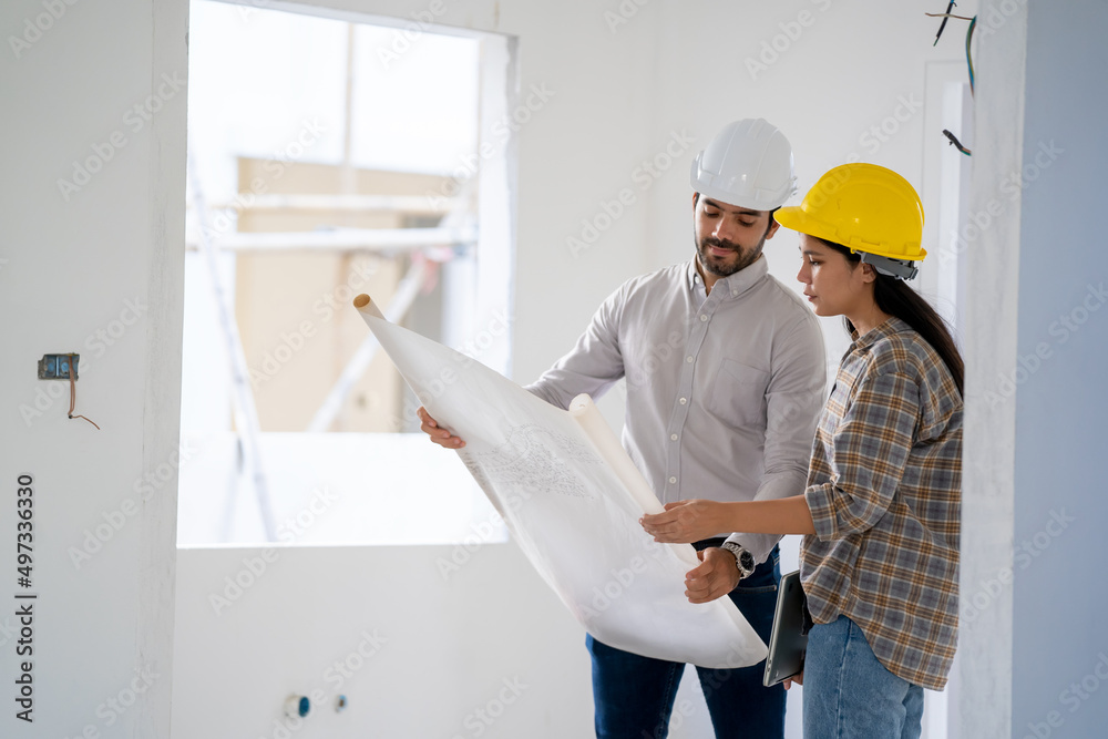 Aufkleber Engineers and woman architect working and reading instruction meeting for project and working on a building site.