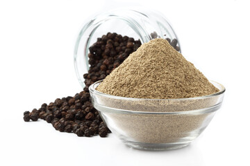 Indian spices - black pepper powder,Black pepper corns scattered on white background and Black pepper Powder on Glass bowl isolated on white background.